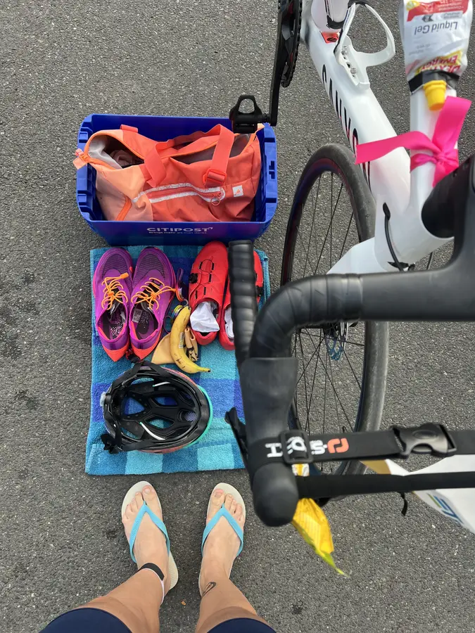 Zoe's first triathlon transition zone, Hannover Sprint 2024 — bike, gear, banana, flip flops